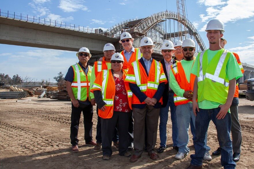 Congressman Jim Costa and group of officials and workers at San Joaquin River Viaduct construction site