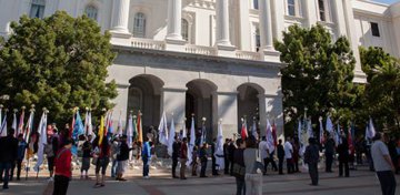Native American Day at the California State Capitol, September 22, 2017. Flag bearers carry the flags of California’s Tribal Nations in front of the California State Capitol in Sacramento. Photo by HSR.