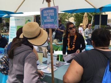 Visitors at Authority table at Disney Environmentality Earth Day event