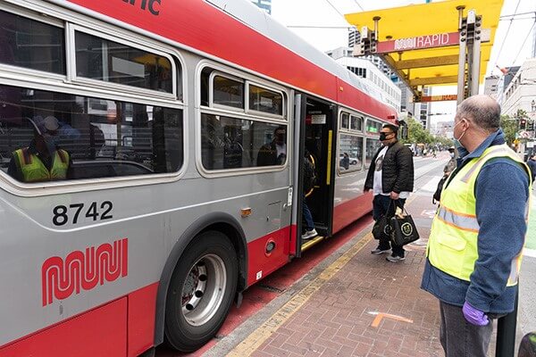 Muni bus in San Francisco with passengers boarding