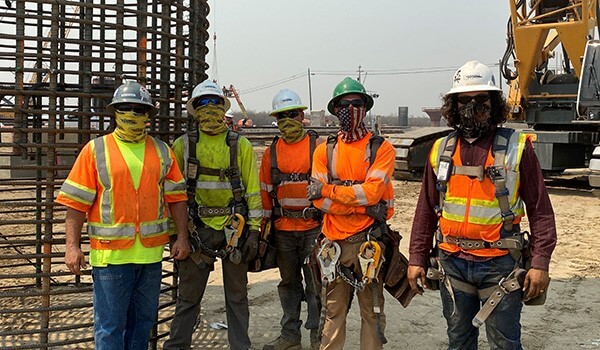Group of construction workers with masks