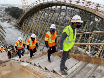 Authority CEO Brian Kelly shows the site of the Cedar Viaduct to USDOT FRA Deputy Administrator Amit Bose, them and other Authority experts climbing the falsework that will help cast one of the concrete arches of the Cedar Viaduct which will carry trains at more than 200 miles per hour over State Route 99.