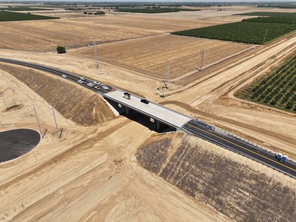 A birds-eye view of Flint Ave overcrossing with cars on the overcrossing. 